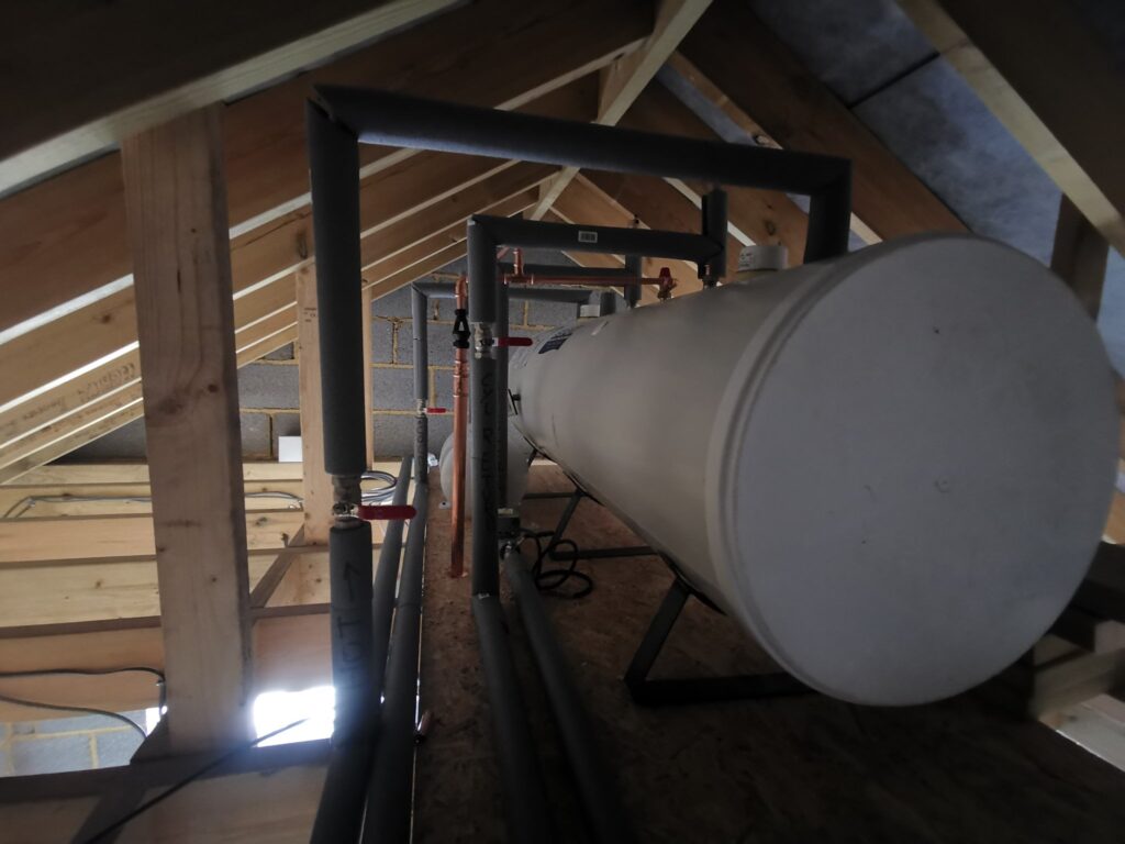Hot water cylinder installed in loft